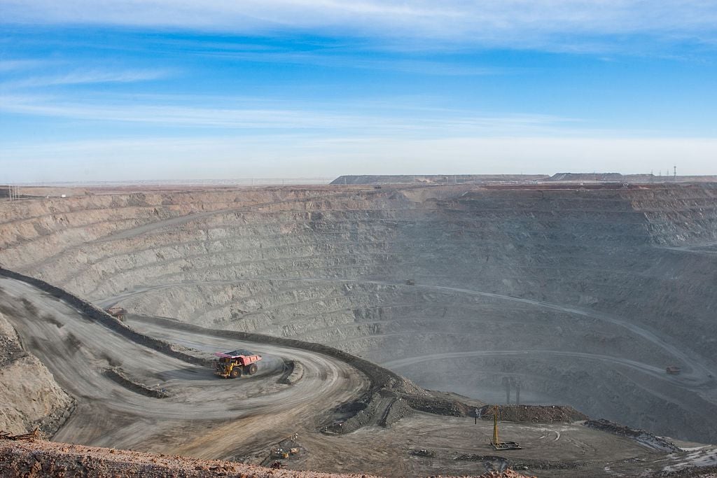 Which countries are in deep trouble from a mining downturn?