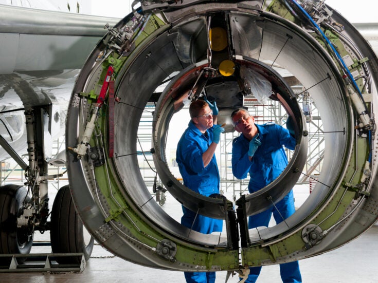 engineers-inspecting-passenger-jet