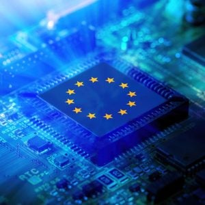 EU flag on a CPU processor. European chip manufacturer concept, GPU microchip on a motherboard.